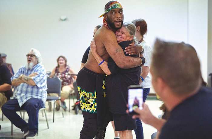 Skrilla the Great embraces a fan.